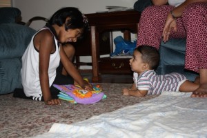 Sara chechi reading a book that Dawn Aunty & Pete Uncle gave me